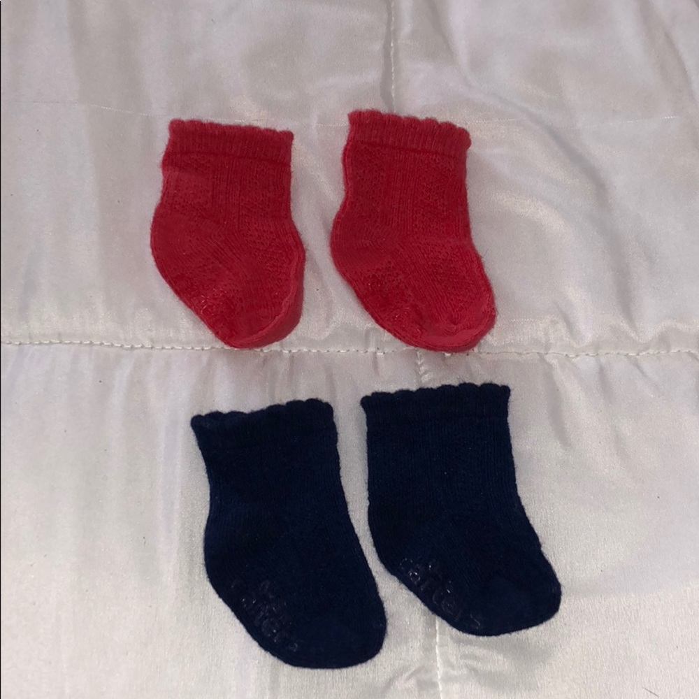 Carter’s newborn sock set in red and blue.